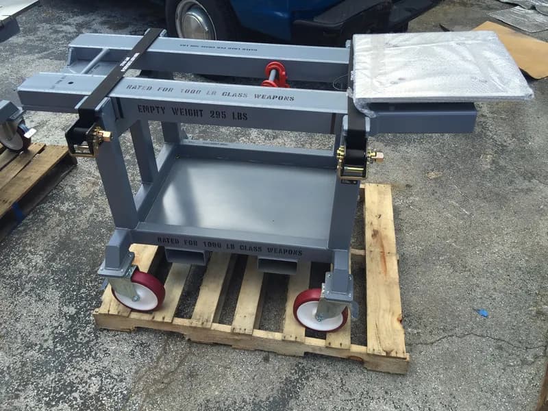 Defense-rated equipment handling cart, a fabricated assembly.